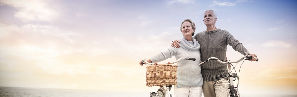 image of couple riding bikes in sunset