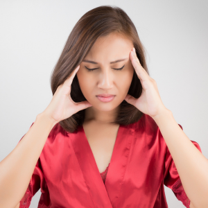woman holding her temples trying to soothe her dizziness